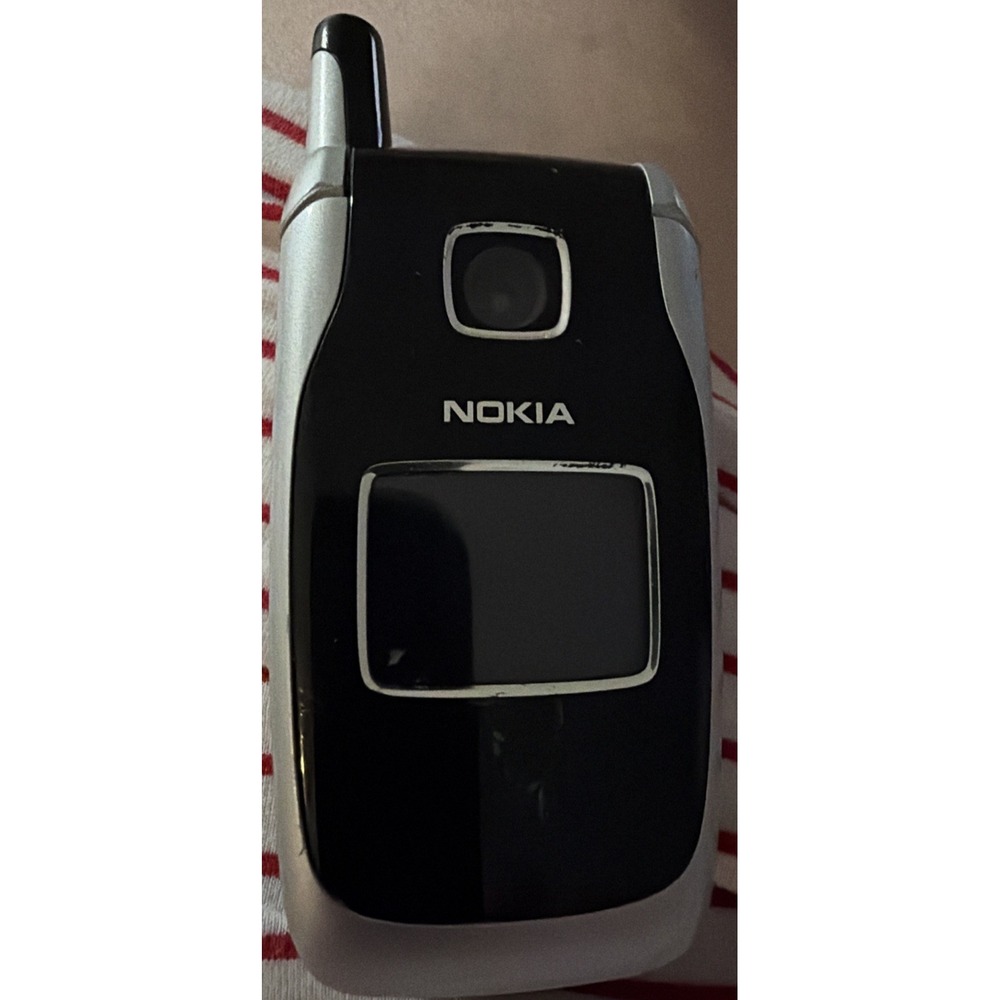 Nokia 6102i flip phone.It was released in 05 features a VGA camera Untested